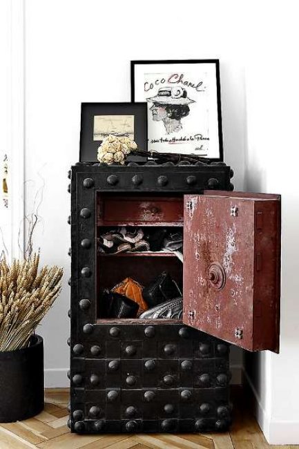 One of the popular options for placing a safe in the living room interior
