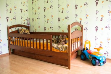 Cots from the year for boys and girls: Multifunctional designs that will be comfortable for babies